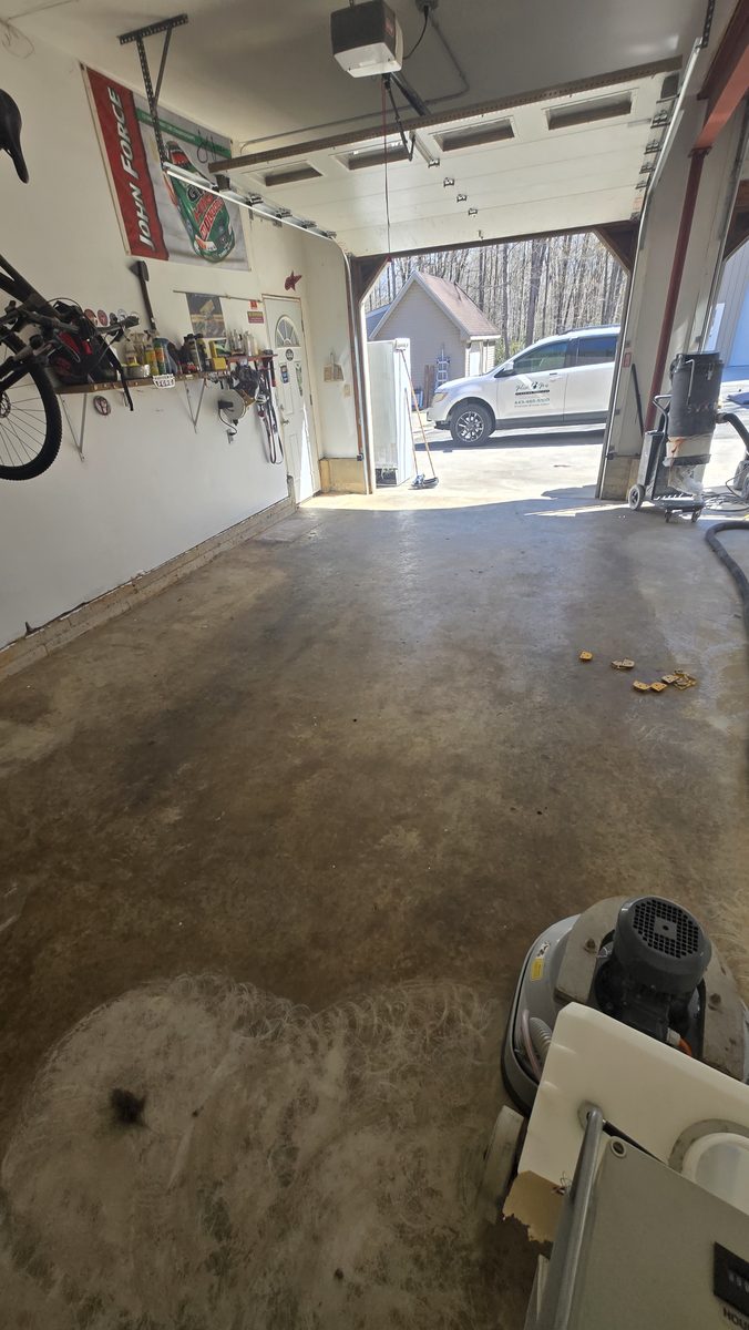 Bare concrete garage floor before coating